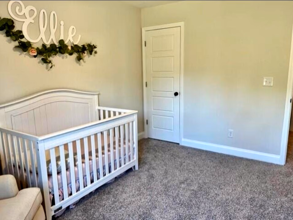 Secondary bedroom currently styled as a nursery