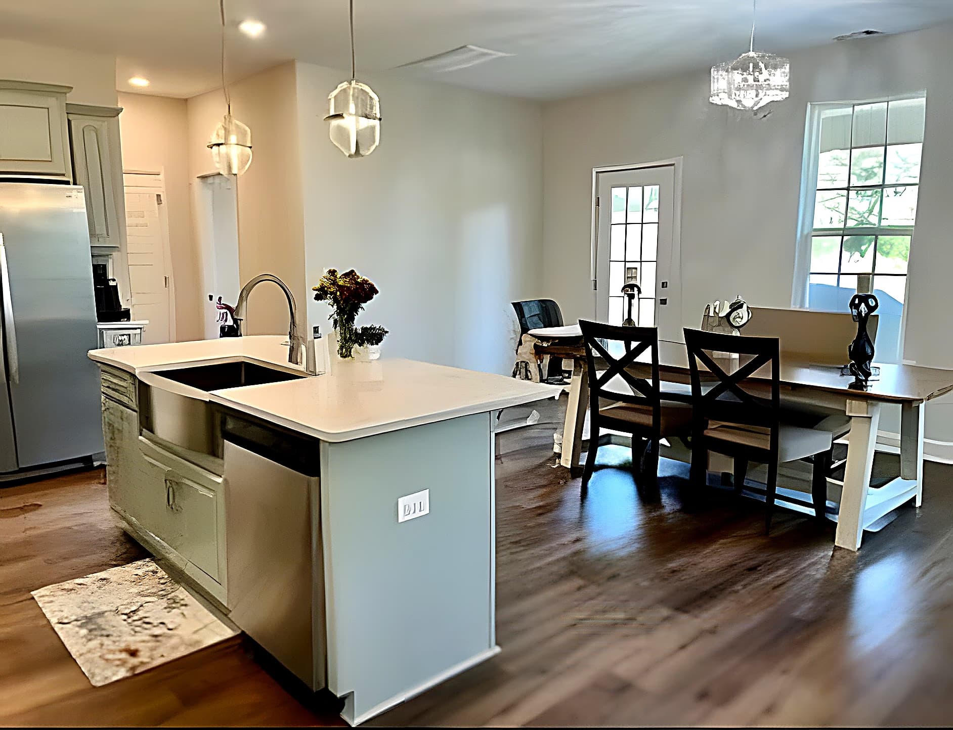 Kitchen island with farmhouse sink overlooking the dining area