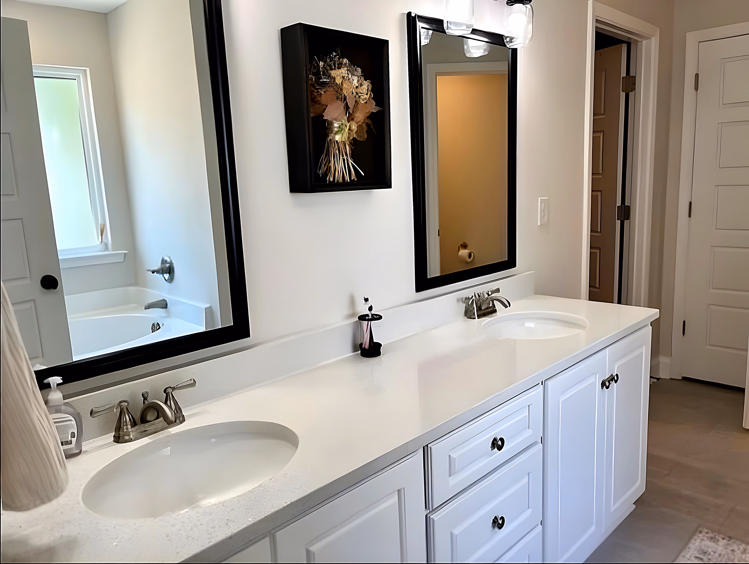 Primary bathroom with double vanity and garden tub